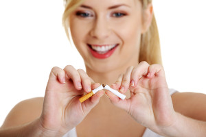 nonsmoker girl breaking cigarette